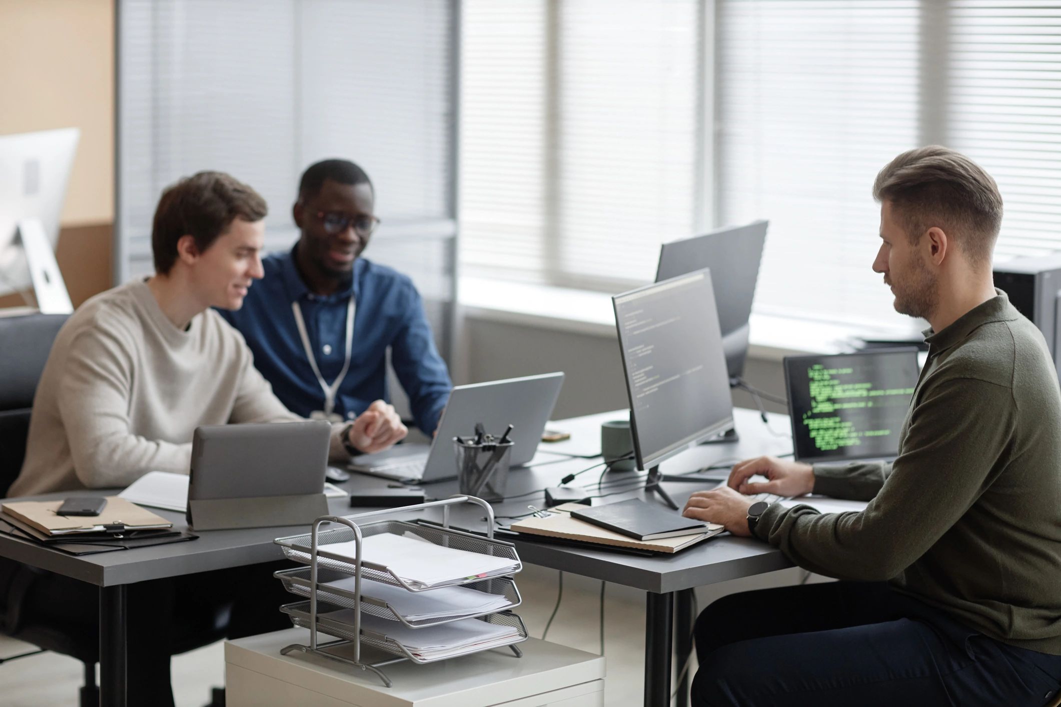 Software team collaborating in a modern workspace